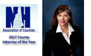 Photo of Michaela Andruzzi next to Logo of NH Ass'n of Counties - below the logo are words "2017 County Atty of the Year."